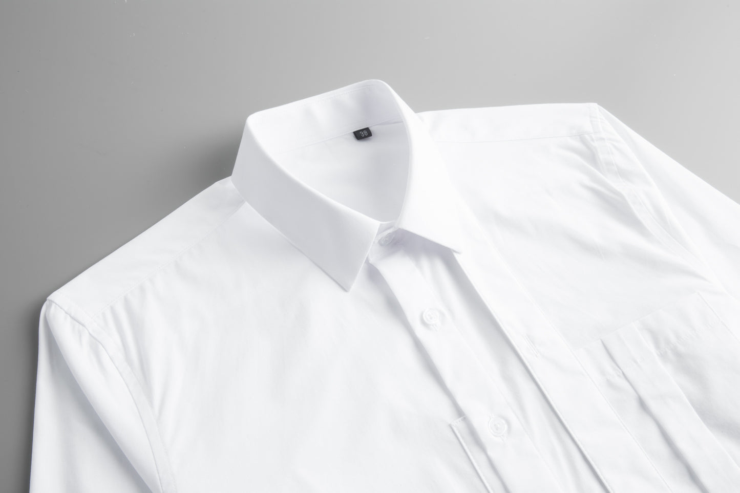 Men's shirt with pocket pleats and ribbon decoration