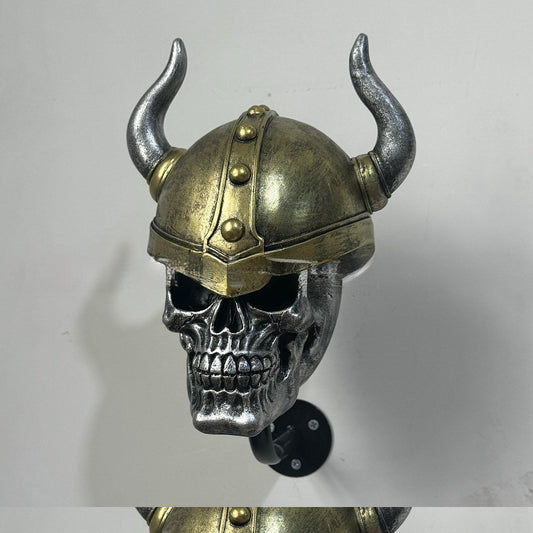 Decorative helmet holder with skull made of synthetic resin