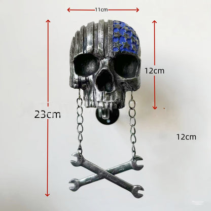 Decorative helmet holder with skull made of synthetic resin